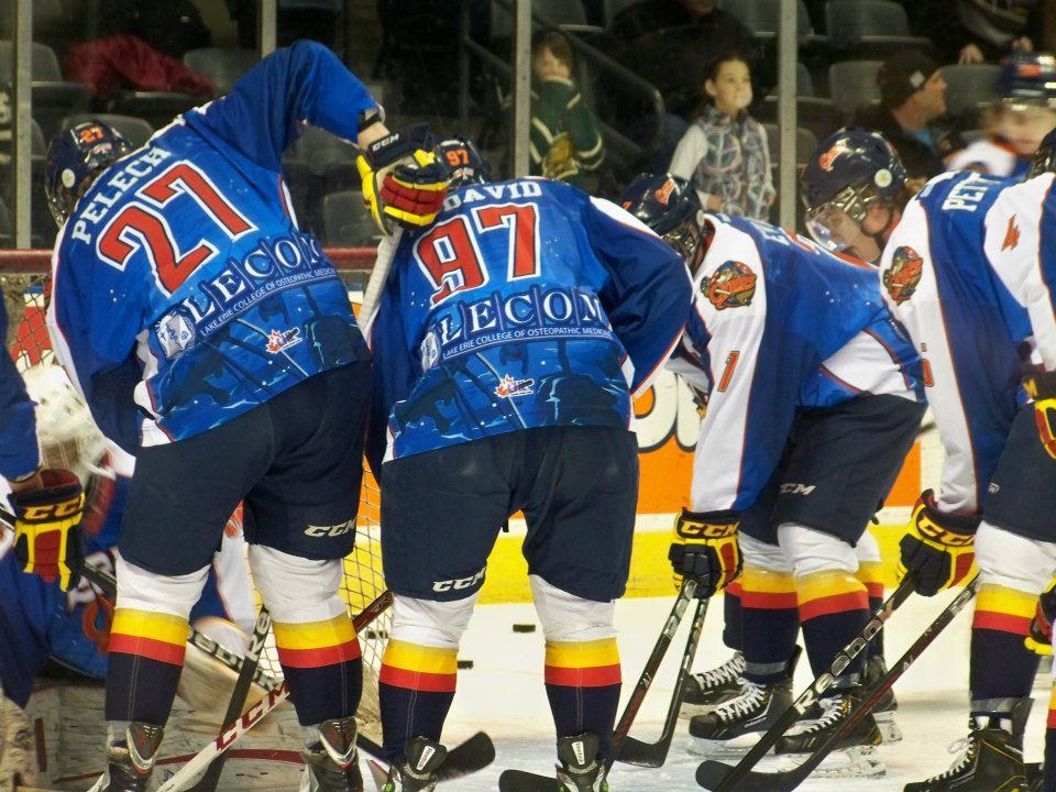 The Erie Otters lined up in warm-ups, McDavid’s number 97 nameplate visible, 2013.