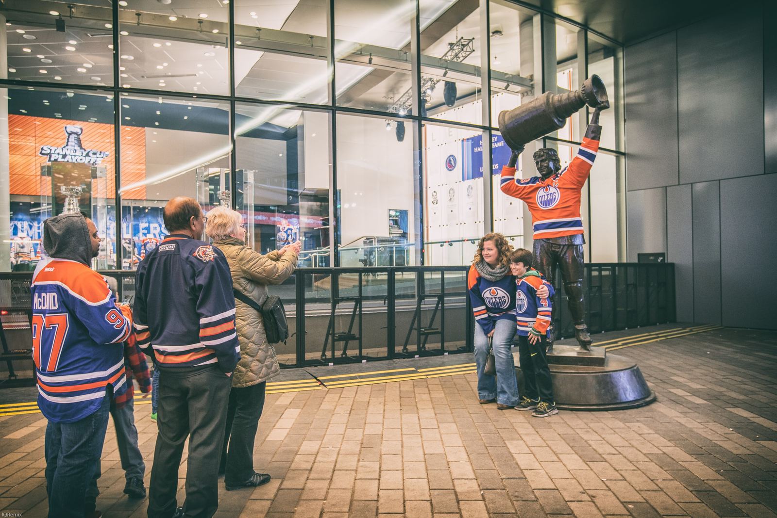 Edmonton Oilers fans in team jerseys gathered at the Wayne Gretzky statue during the 2017 playoff run.